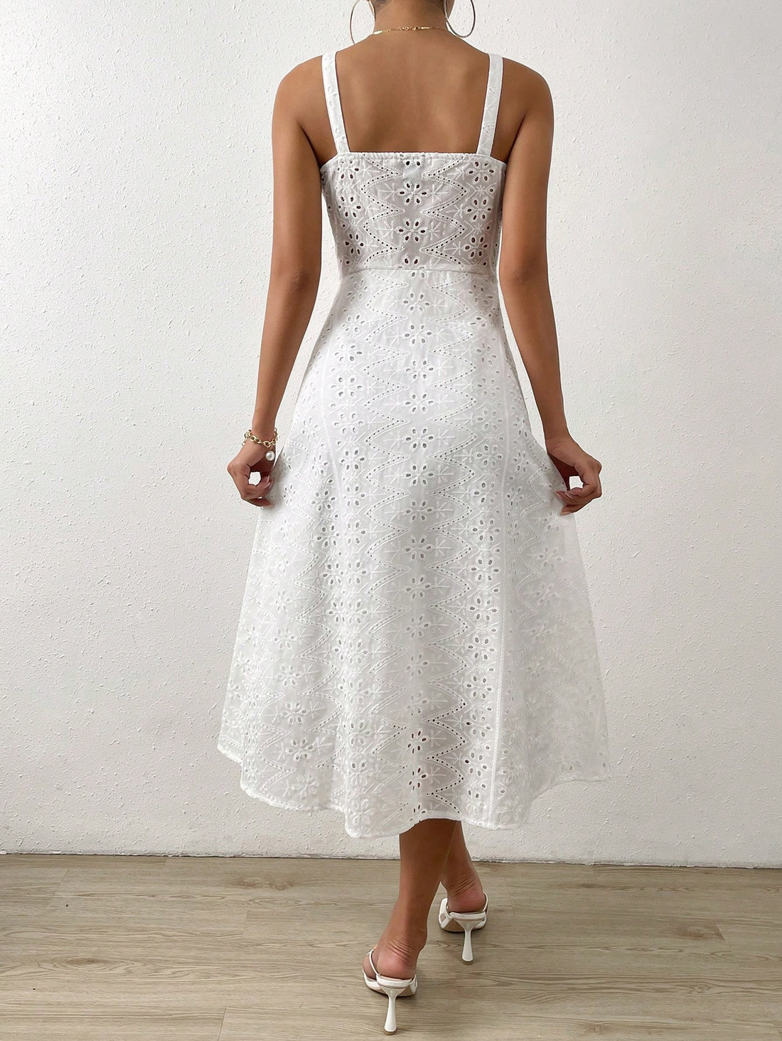 Elevate your style with our Chic in Eyelet: The Frenchy Embroidery Button Through Cami Dress. Made with delicate eyelet embroidery and a button-through design, this dress is the perfect combination of elegance and charm. Its lightweight fabric and flattering silhouette make it a must-have for any occasion.