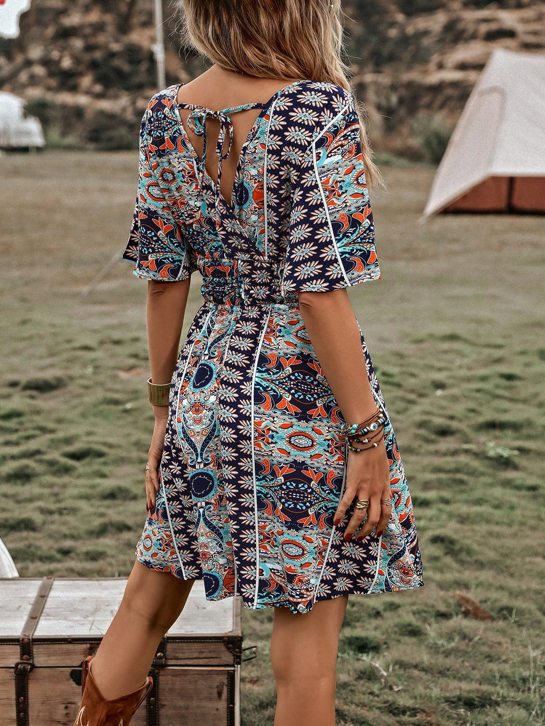 This charming dress features a beautiful allover butterfly print and flowy sleeves, creating a romantic and feminine look. The included belt cinches at the waist, flattering the figure. Perfect for any occasion, this dress will elevate your style with its playful yet elegant design.