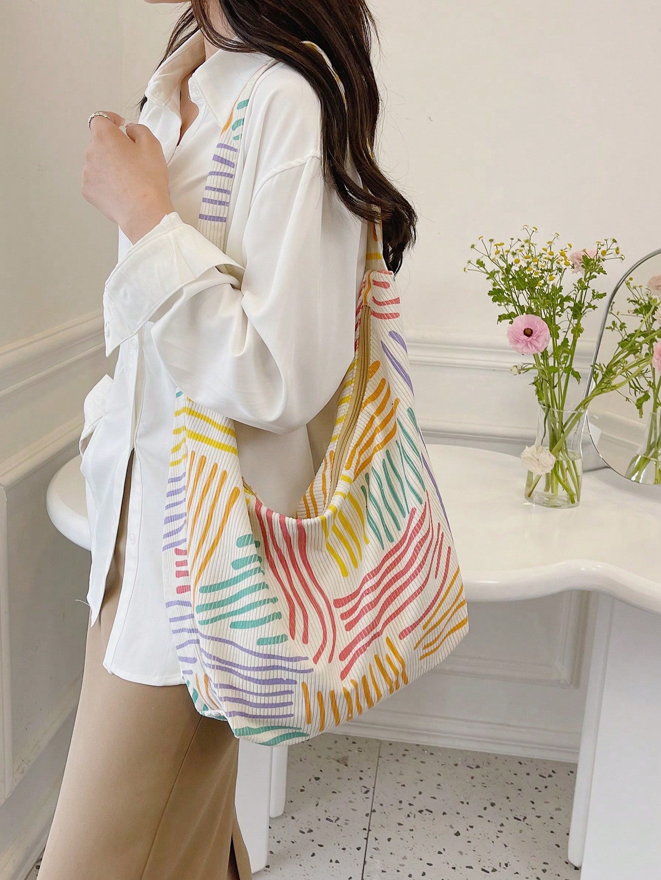 Introducing our Chic and Colorful Oversized Hobo Bag: The Perfect Statement Piece. Made with high quality materials and a spacious design, this bag is perfect for any stylish individual. Stand out with its trendy colors and eye-catching details. Upgrade your wardrobe with this must-have fashion accessory.