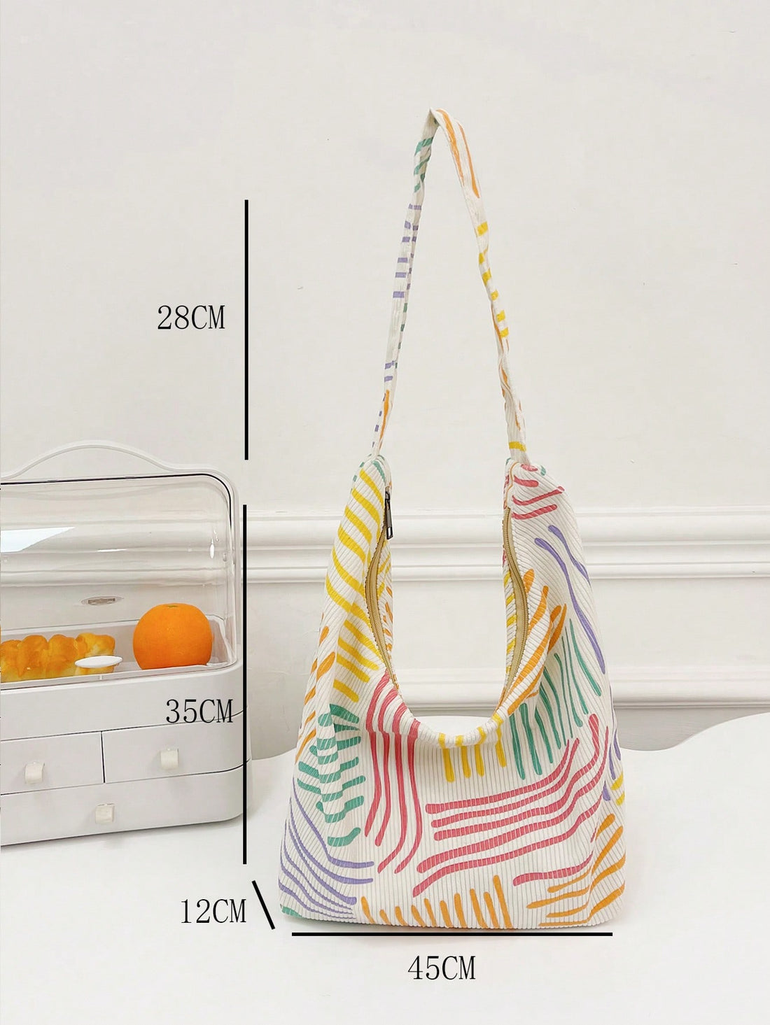 Introducing our Chic and Colorful Oversized Hobo Bag: The Perfect Statement Piece. Made with high quality materials and a spacious design, this bag is perfect for any stylish individual. Stand out with its trendy colors and eye-catching details. Upgrade your wardrobe with this must-have fashion accessory.