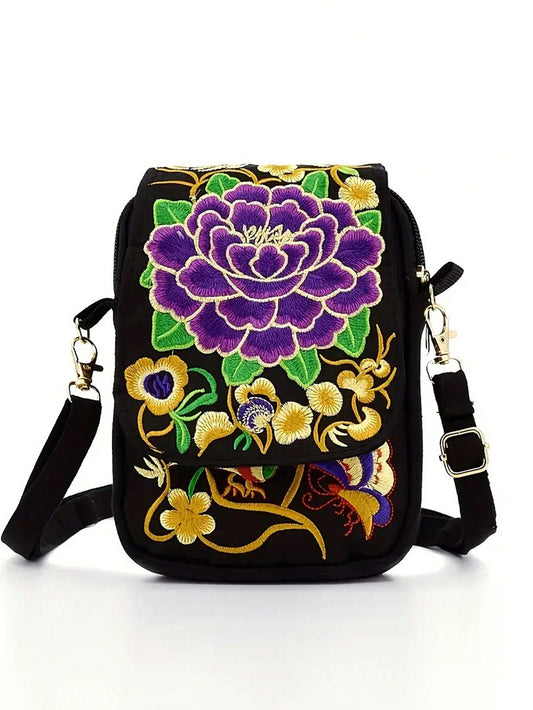 Enhance your style with the Stylish Embroidered Crossbody Bag. This small canvas bag features intricate embroidery, making it a unique and elegant accessory. With a zipper phone holder, you can easily access your phone while on-the-go. Perfect for a day out, this bag combines fashion and function seamlessly.