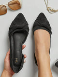Black knot flats top view with pointed toe shape