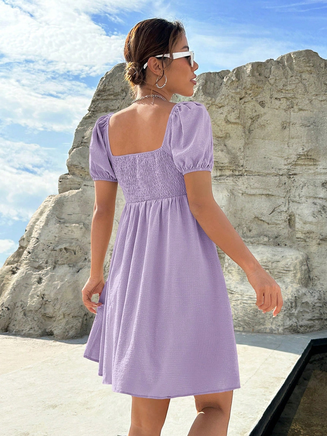 Make a statement in this Chic Lilac Milkmaid Dress! With its playful puff sleeves and ruched bust, you'll be the center of attention at any occasion. Whether you're going to a wedding or just a night out with friends, this dress is perfect for adding a touch of charm to any outfit.