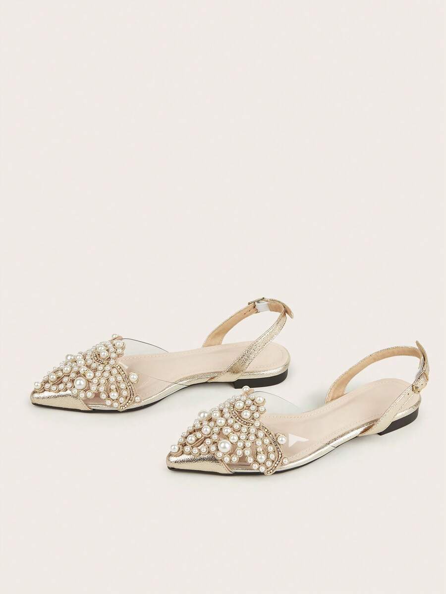Elevate your fall and winter wardrobe with these sophisticated slingback flats. Featuring delicate faux pearl embellishments and a refined point toe silhouette, these flats blend timeless elegance with modern comfort. The slingback design provides secure support while maintaining a sleek, polished look perfect for both casual outings and dressier occasions. 
