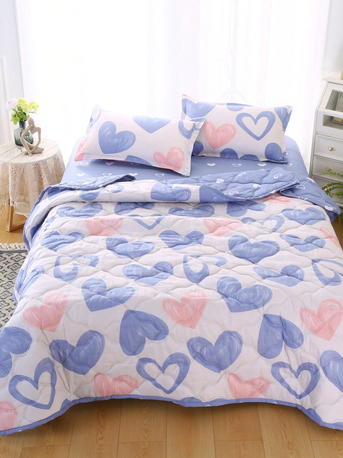 Create a cozy bedroom with Heartfelt Dreams, the perfect fabric quilt bedspread. With its cute design and high-quality materials, this bedspread is sure to bring warmth and comfort to your space. Transform your bedroom into a dreamy oasis with Heartfelt Dreams.