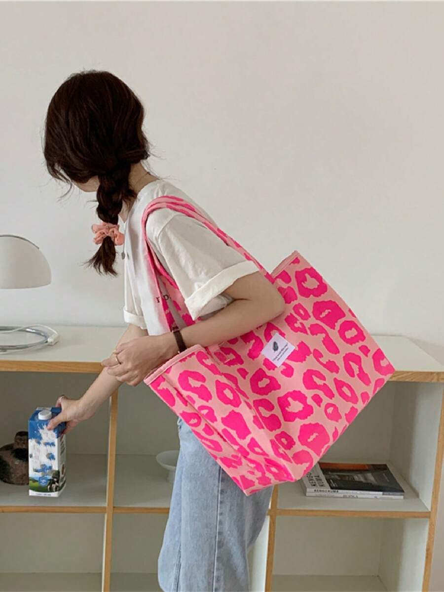 Elevate your everyday carry with this chic leopard print shoulder tote. Crafted from luxurious 100% viscose, this oversized bag features a ruched design and all-over print pattern that adds effortless style to any outfit. The spacious interior and secure zipper closure make it perfect for work, travel, or weekend getaways. Dual handles ensure comfortable carrying, while the casual aesthetic works seamlessly from day to night. An ideal companion for vacation season or a thoughtful gift for the style-consciou