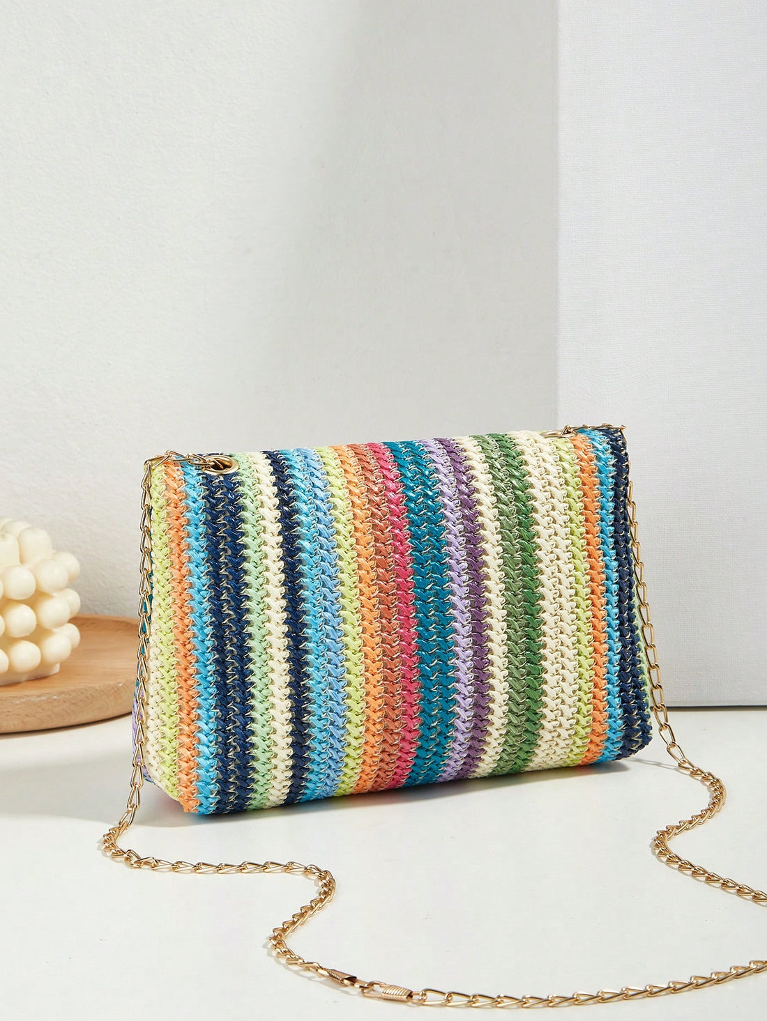 This Rainbow Dreams straw <a href="https://canaryhouze.com/collections/canvas-tote-bags" target="_blank" rel="noopener">bag</a> is perfect for your vacation getaway with its colorful striped pattern. The flap closure keeps your essentials secure while adding a touch of style. Its lightweight design makes it easy to carry around, making it the ideal travel companion.