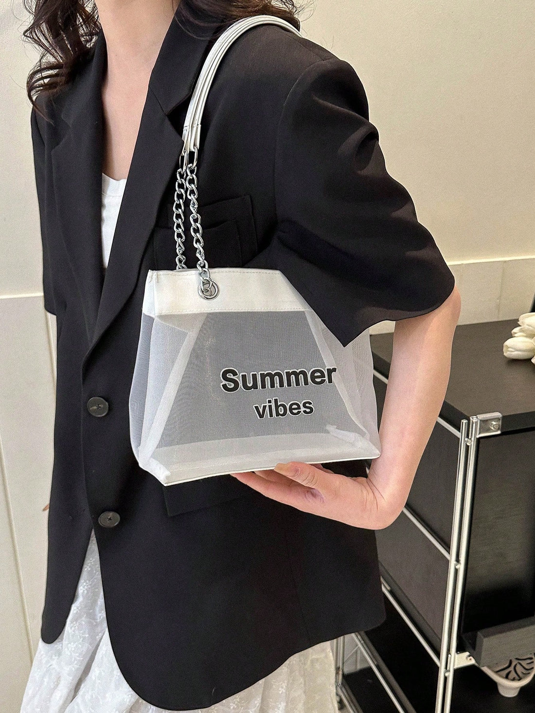 This transparent tote bag is the ultimate lightweight handbag for fashionable women. With a chic and trendy design, it is both stylish and practical. Made from lightweight material, it is perfect for carrying all your daily essentials with ease. Stand out and stay organized with this must-have accessory.