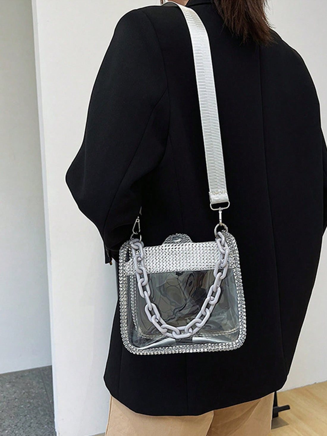 Elevate your style with the Crystal Clear Rhinestone Chain Bag. This chic and stylish mini crossbody features a dazzling rhinestone chain that adds a touch of glamour to any outfit. Made with high-quality materials, it's both functional and fashionable. Perfect for a night out or adding some sparkle to your everyday look.
