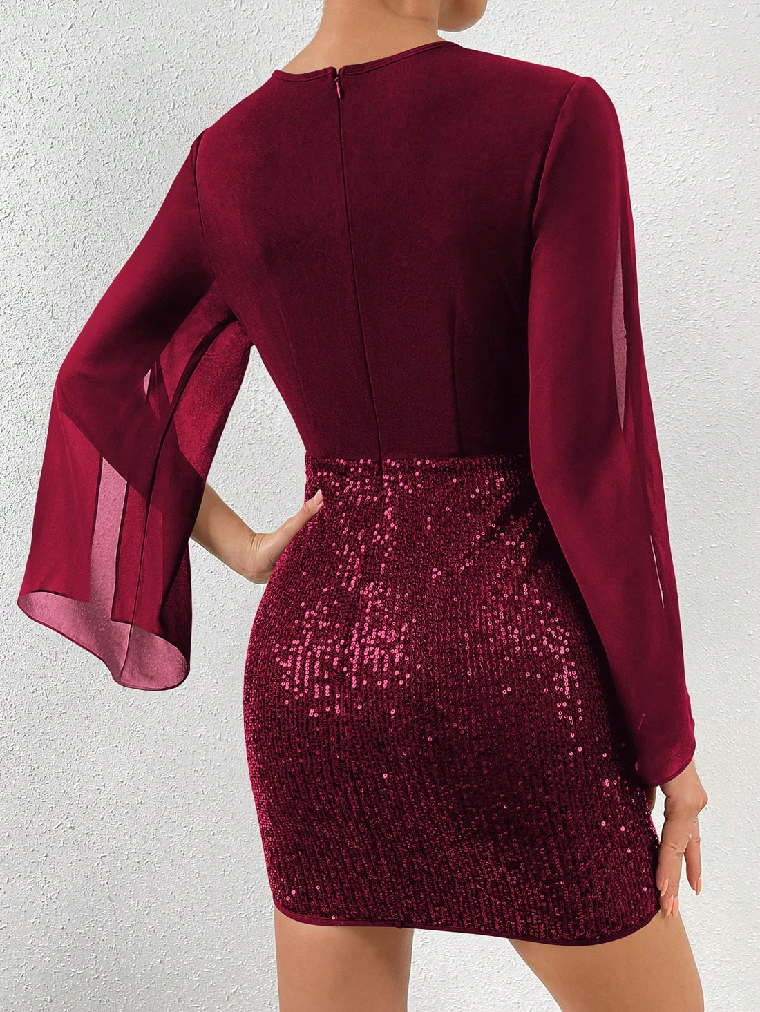Celebrate the New Year in style with our Sequin Sleeve Bodycon Dress in Wine Red. This elegant dress features stunning sequin sleeves that will make you shine all night long. Say cheers to the New Year in this playful, yet sophisticated dress!