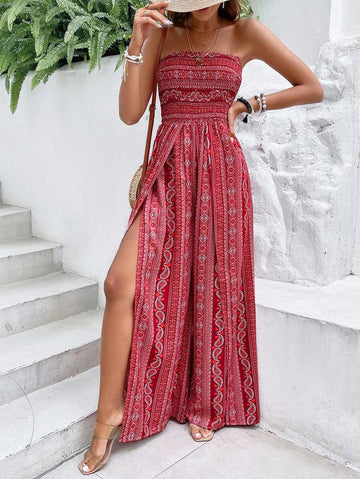 red front view of paisley strapless smocked wide-leg jumpsuit with thigh split