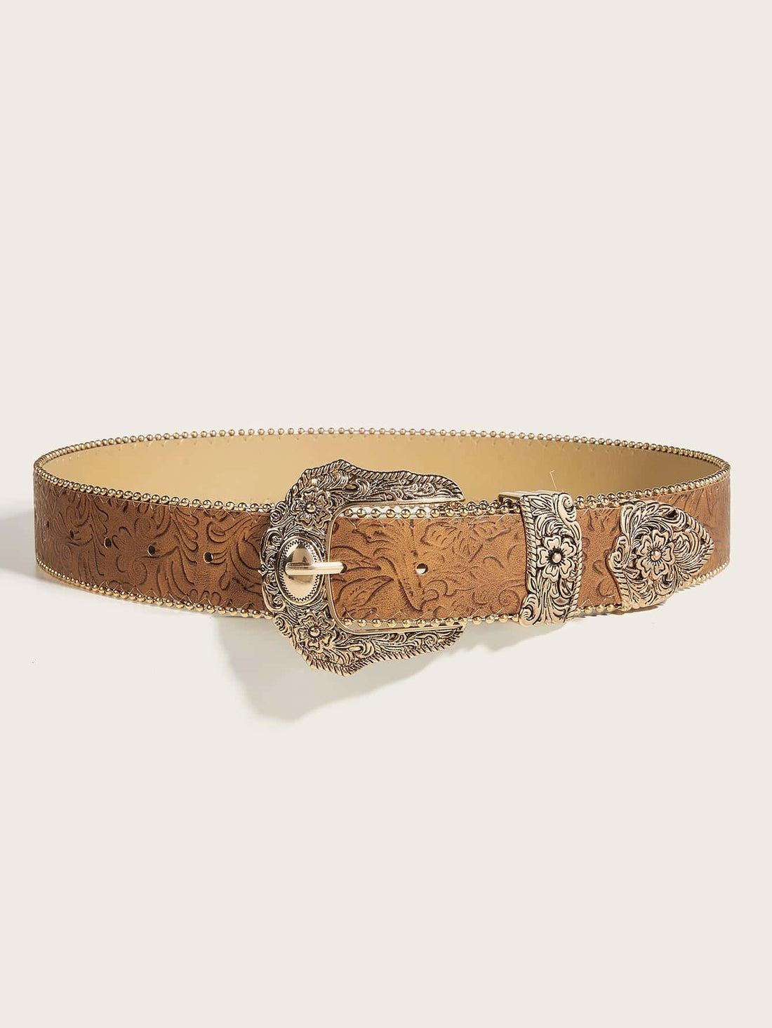 This Boho Chic Floral Geo Buckle Western Belt is the perfect addition to your wardrobe. With its unique floral design and stylish geo buckle, it is sure to elevate any outfit. Made for both stylish jeans and for Halloween fun, it offers versatility and statement-making flair.