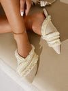 Bohemian Bliss: Beige Pom Pom Ruffle Flats for Vacation Chic