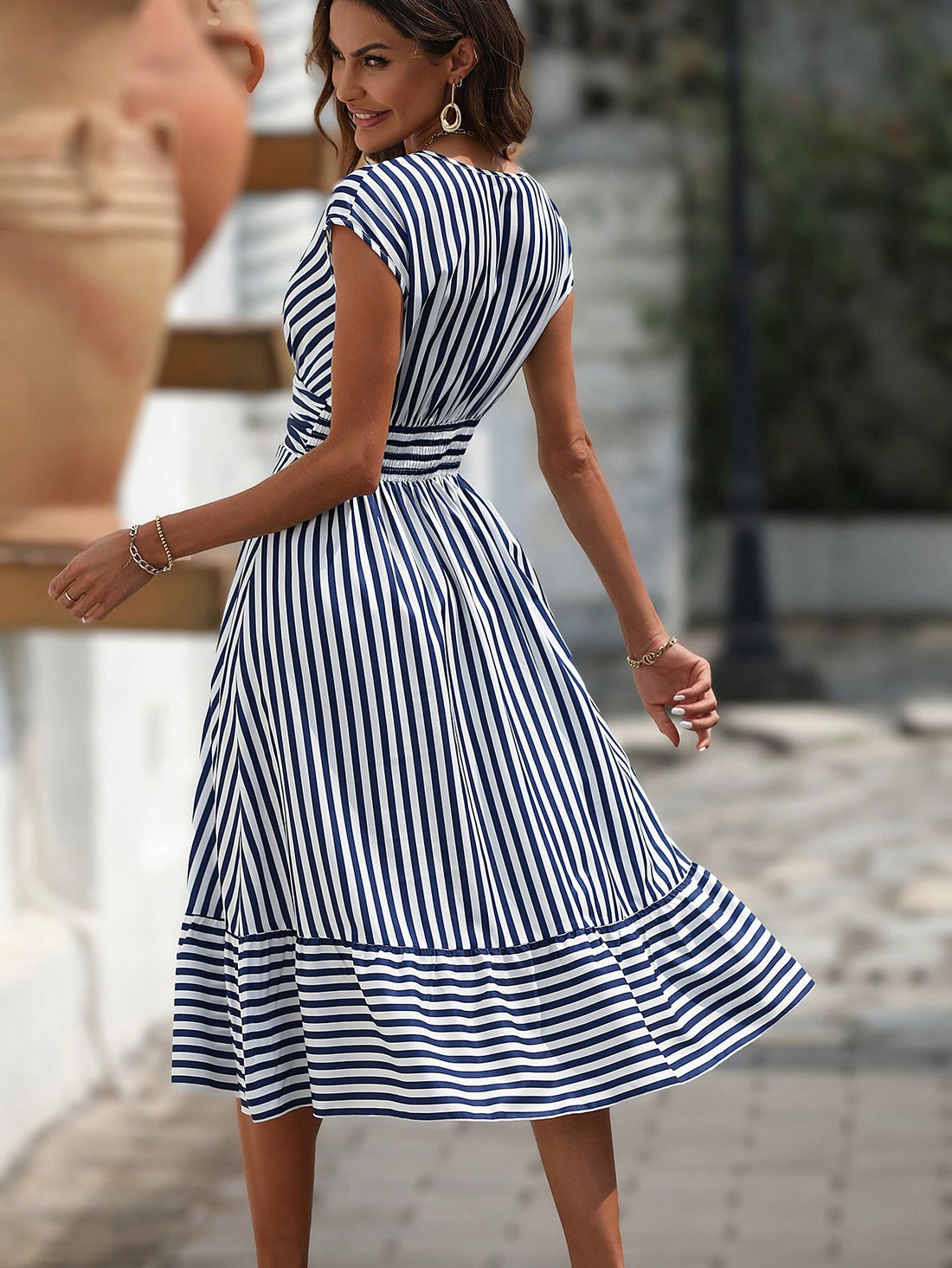 Step out in style with our Chic Striped Ruffle Hem Dress, perfect for any occasion. This dress features a flattering ruffle hem and a timeless striped print, making it a versatile addition to your wardrobe. Stay on trend and make a statement with this must-have dress.