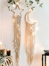 Elevate your space with our Divine Dreams: Moon and Star Tassel Wall Hanging Set. Crafted with precision and detail, this set adds a touch of celestial charm to any room. The intricately designed moon and star tassels create a serene atmosphere while infusing a sense of wonder and enchantment.