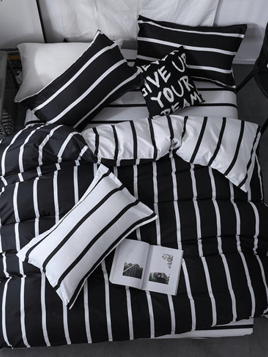 Experience the timeless elegance of our Monochrome Magic duvet cover and pillowcase set. Crafted with high-quality, soft cotton, the black and white striped design adds a touch of sophistication to any bedroom. Transform your space into a luxurious oasis with this stylish and comfortable bedding set.