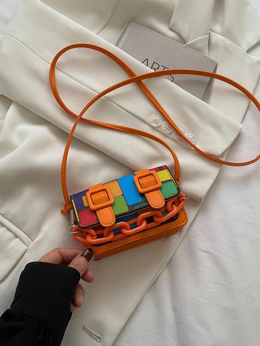 Back view of mini polyurethane crossbody bag with adjustable strap