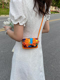 Front angle of khaki mini square bag with adjustable strap