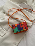 Close-up of buckle closure on the mini square crossbody bag