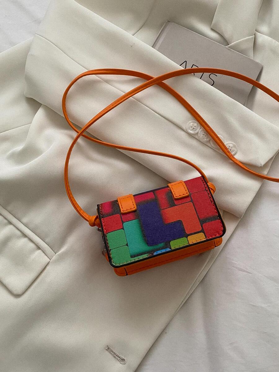 Close-up of buckle closure on the mini square crossbody bag
