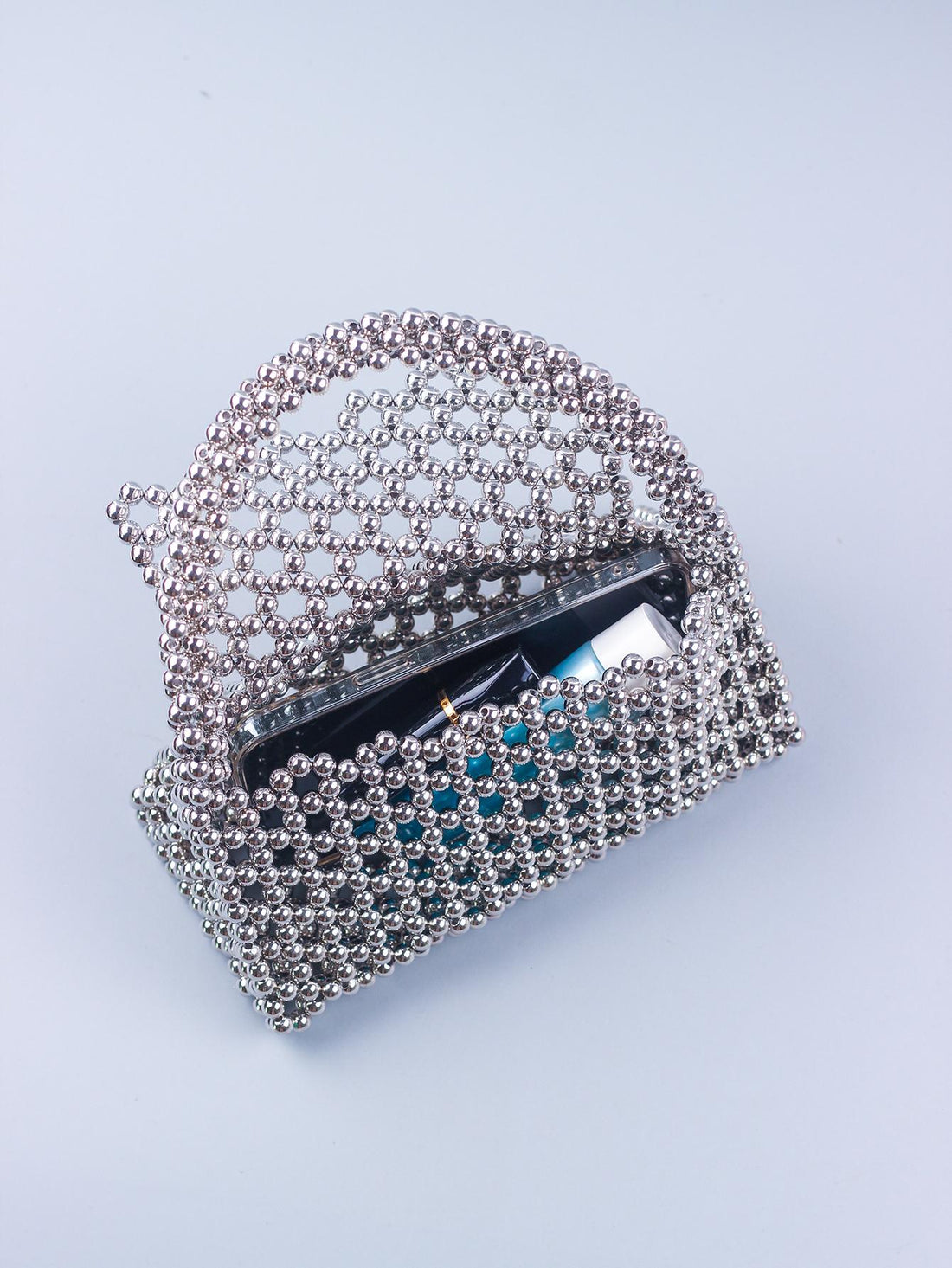 Upgrade your beach, sports, or picnic game with our Chic Hollow Out Beaded Transparent Tote Bag! Stay stylish while keeping your belongings dry and free from sand with our waterproof and sandproof design. Plus, the chic and unique hollow out beaded details add a touch of glam to any outfit. Get ready to turn heads and make a statement with this must-have bag!