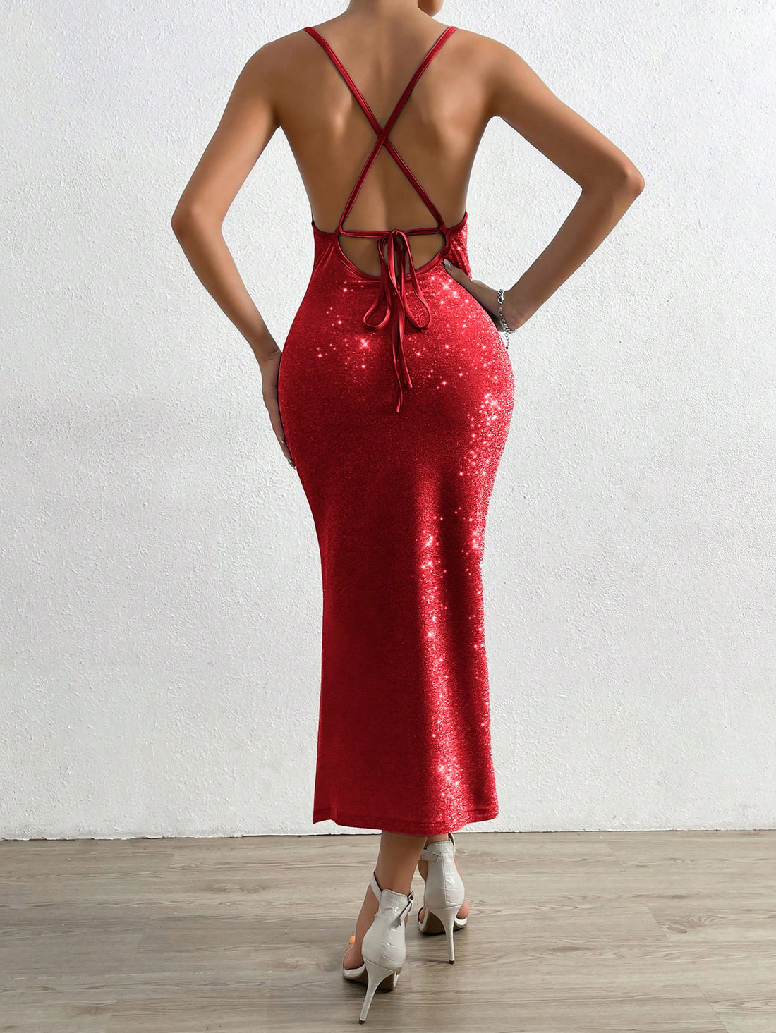 This elegant backless cami dress features a draped collar and split thigh design, creating a sophisticated and stylish look. The open back accentuates your curves while the split thigh adds a touch of seductiveness. Perfect for any special occasion or night out.