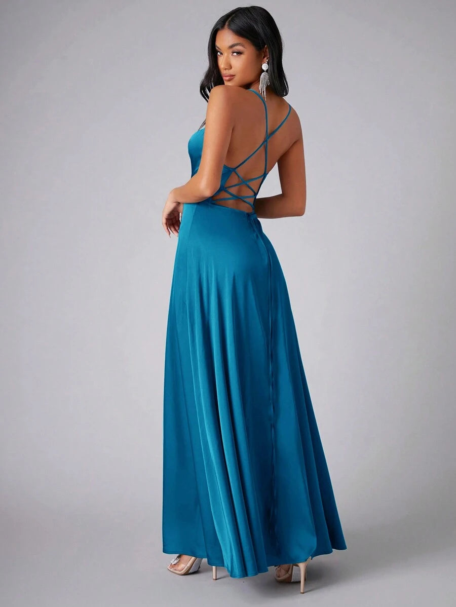 Back view of teal dress with crossed straps and long skirt