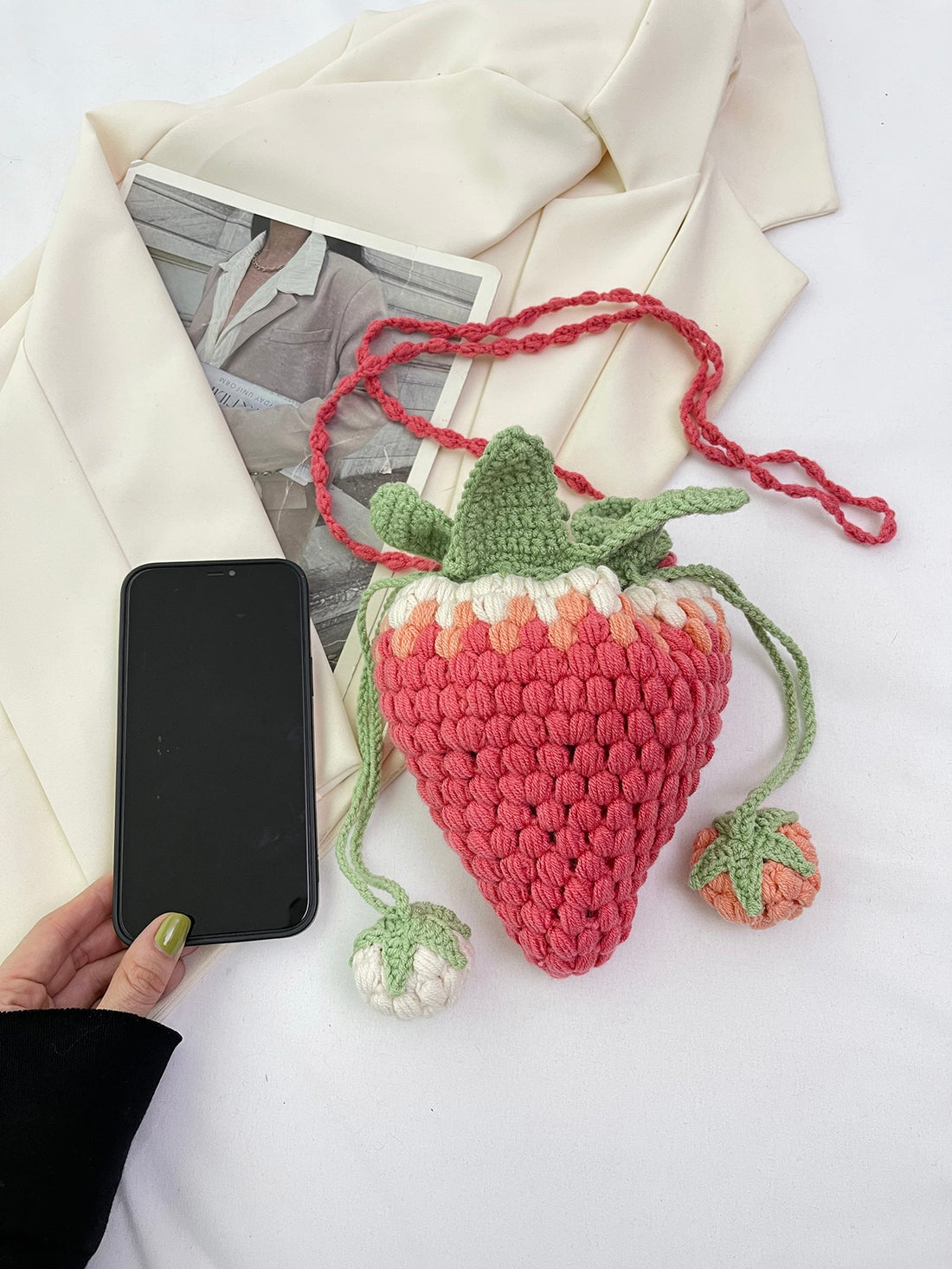 Expertly crafted with love and care, the Handmade Delight: Colorful Knitted Strawberry Crossbody Bag is a unique and charming accessory. Its intricate knitted design and vibrant colors make it a standout piece. Carry your essentials in style and support local artisans with this handmade bag.