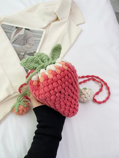 Expertly crafted with love and care, the Handmade Delight: Colorful Knitted Strawberry Crossbody Bag is a unique and charming accessory. Its intricate knitted design and vibrant colors make it a standout piece. Carry your essentials in style and support local artisans with this handmade bag.