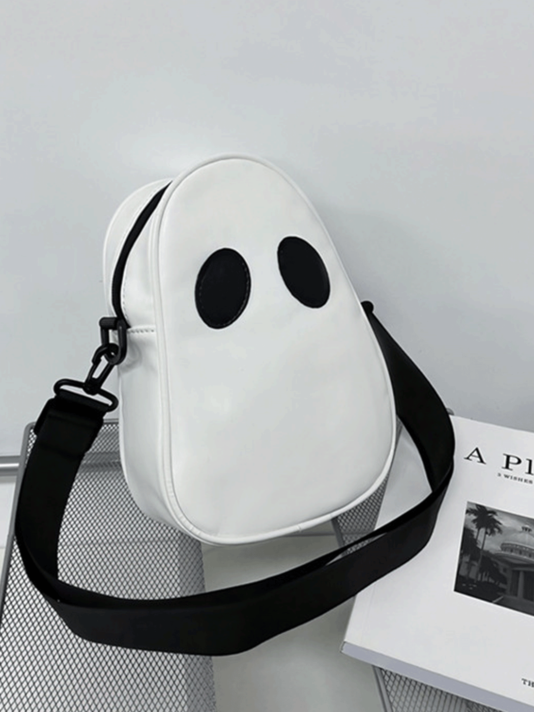 Introducing our Spooky Chic Mini Cute Ghost Design Purse, the perfect novelty crossbody bag for women. With its unique ghost design, this purse brings a touch of charm and playfulness to any outfit. The compact size makes it perfect for carrying around all your essentials, keeping you stylish and organized on the go. 