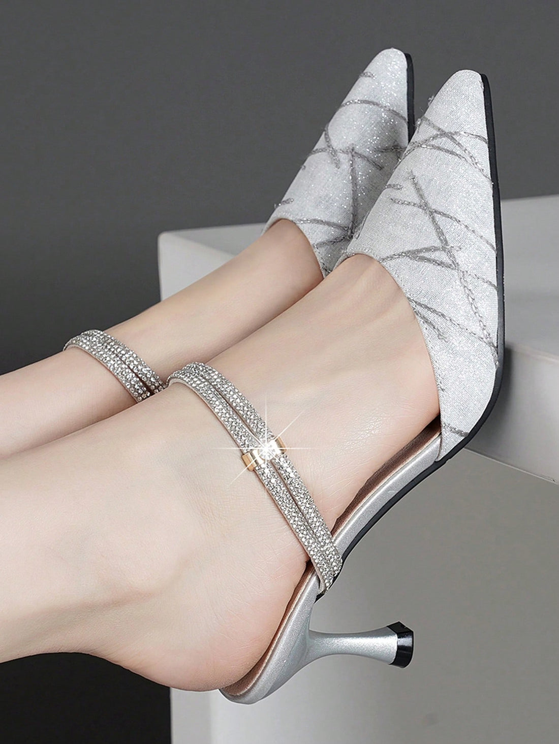 Introducing our Sparkling Elegance: Rhinestone-Embellished High Heel Pointed Toe Slip-On Shoes. Perfect for the 2024 Spring season, these Silver Mix chunky heel high heel pumps offer versatile style for any occasion. Elevate your look with sparkling rhinestone embellishments and a sleek pointed toe design.