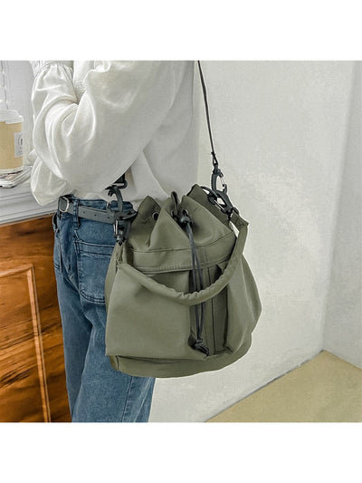 This versatile and stylish tote bag is perfect for anyone looking for a large capacity bag with an adjustable shoulder strap. With its sleek design and ample space, it's suitable for all occasions, whether it's work, school, or travel. Stay organized and fashionable with this must-have accessory.
