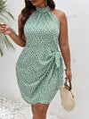 This Chic Frenchy Plus Allover Print Halter <a href="https://canaryhouze.com/collections/women-dresses" target="_blank" rel="noopener">Dress</a> with Knot Side Wrap is expertly crafted with a flattering halter neckline and a knot side wrap detail. Made with a stylish allover print, this dress is the perfect addition to your wardrobe for a chic and fashionable look. Feel confident and stylish in this timeless piece.