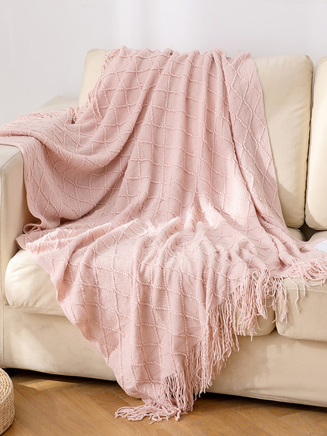 This cozy knitted <a href="https://canaryhouze.com/collections/blanket" target="_blank" rel="noopener">blanket</a> with tassels is the perfect addition to your home or office space. Its soft texture and stylish design make it versatile for use as a blanket, office nap companion, or even a fashionable shawl. Stay warm and stylish with this must-have accessory.