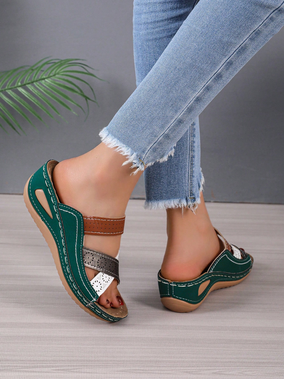 Elevate your style with Sparkling Steps: Rhinestone Decor Wedge Slide Sandals. These fashion-forward sandals feature dazzling rhinestone accents and a comfortable wedge heel for all-day wear. Make a statement and add a touch of glamour to any outfit. 