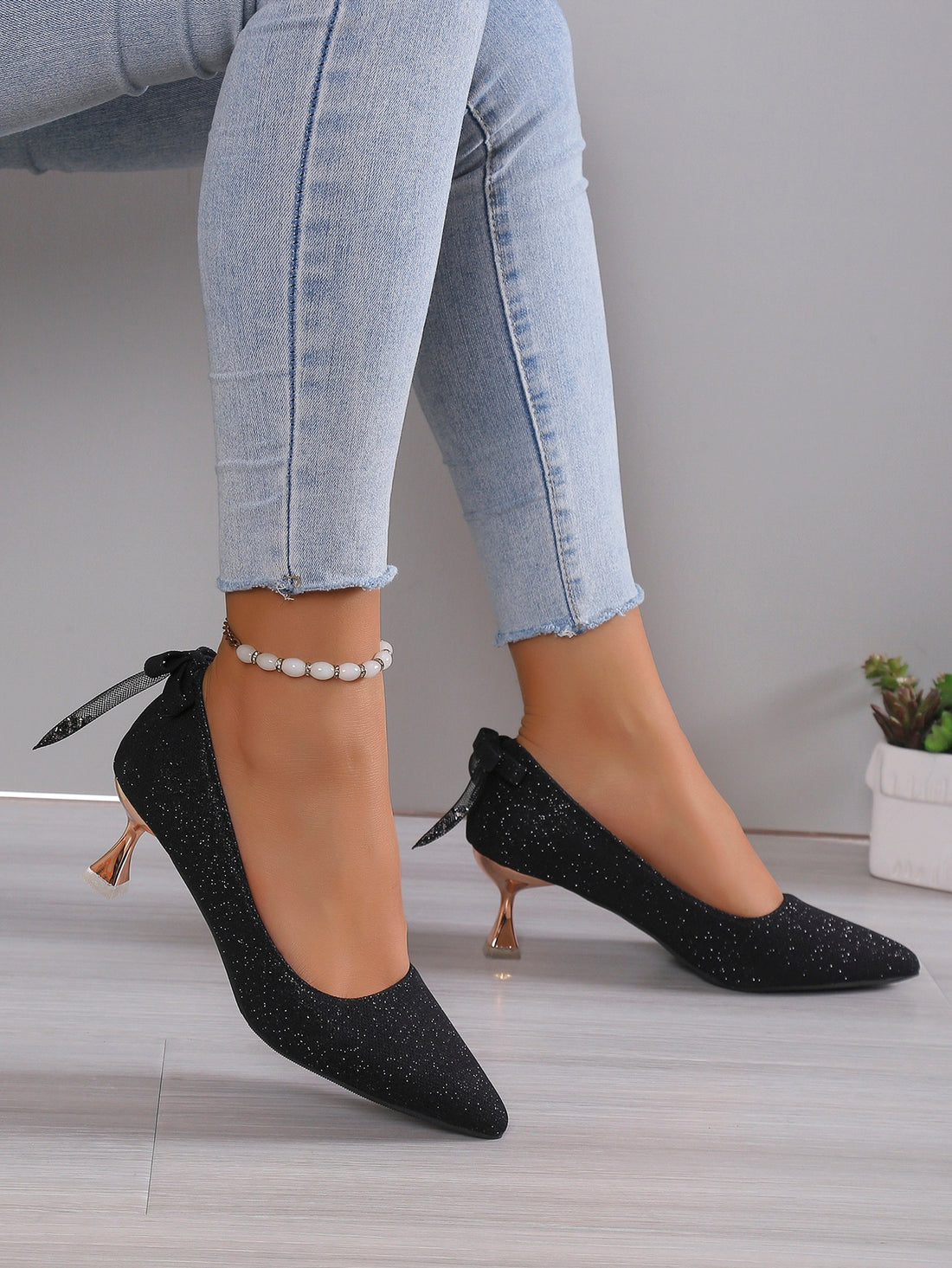 Elevate your bridal ensemble with our Sparkling Stiletto Heels. Designed specifically for weddings, these pointed toe shoes offer a sleek silver finish that sparkles under the lights. With a stiletto heel, these shoes provide both style and stability, making them the perfect choice for any bride.