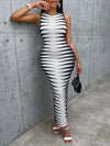 This Bold and Beautiful bodycon dress features a striking black and white allover print, making it a bold statement piece. Its body-hugging silhouette accentuates your curves, while its high-quality materials provide both comfort and style. Make a confident and stylish statement with this must-have dress.