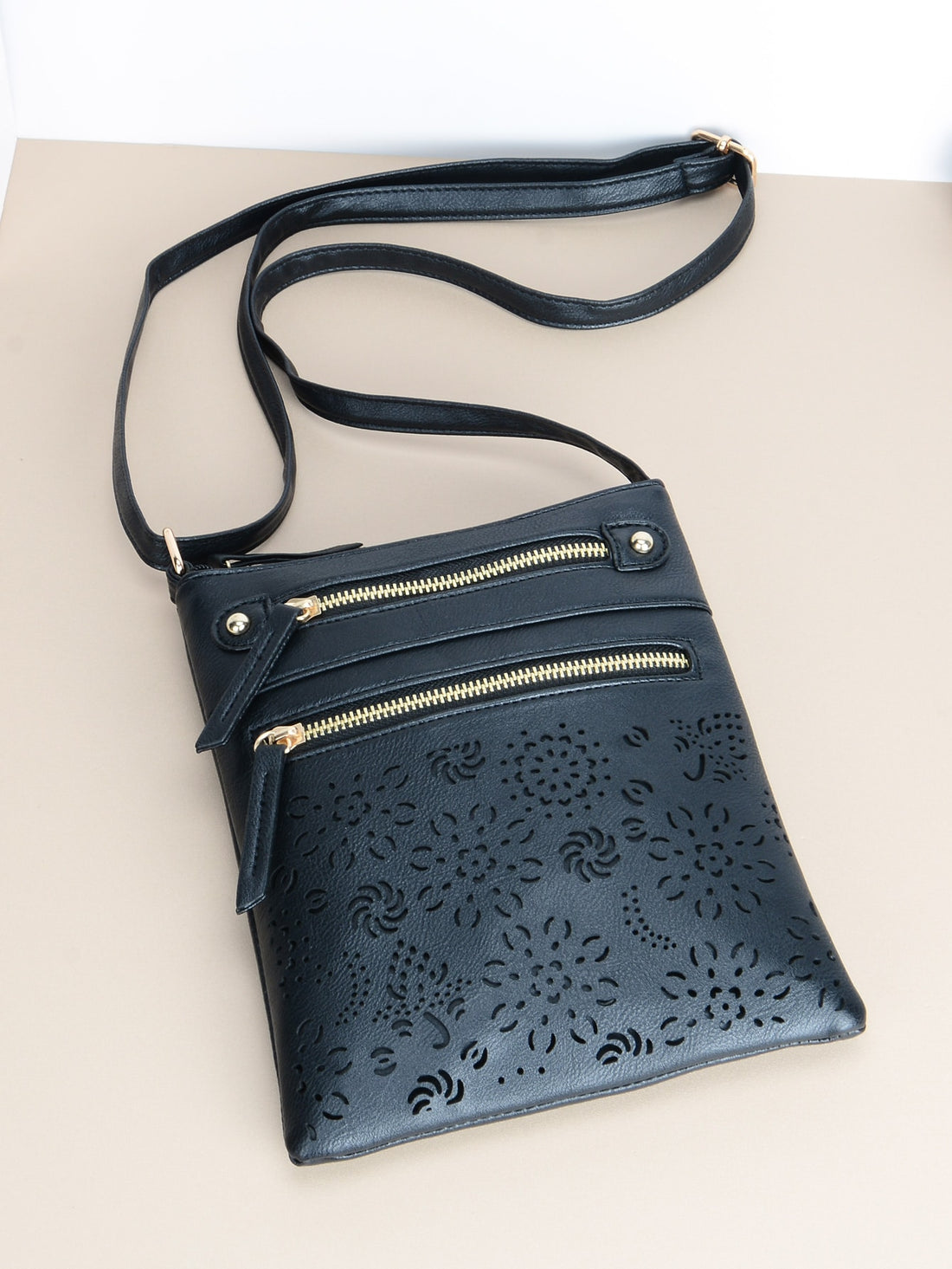 Expertly crafted with a retro chic design, this brown square crossbody bag features double zippers for added style and functionality. Its versatile size makes it perfect for everyday use, while the durable material ensures long-lasting quality. Elevate your accessory game with this must-have bag.