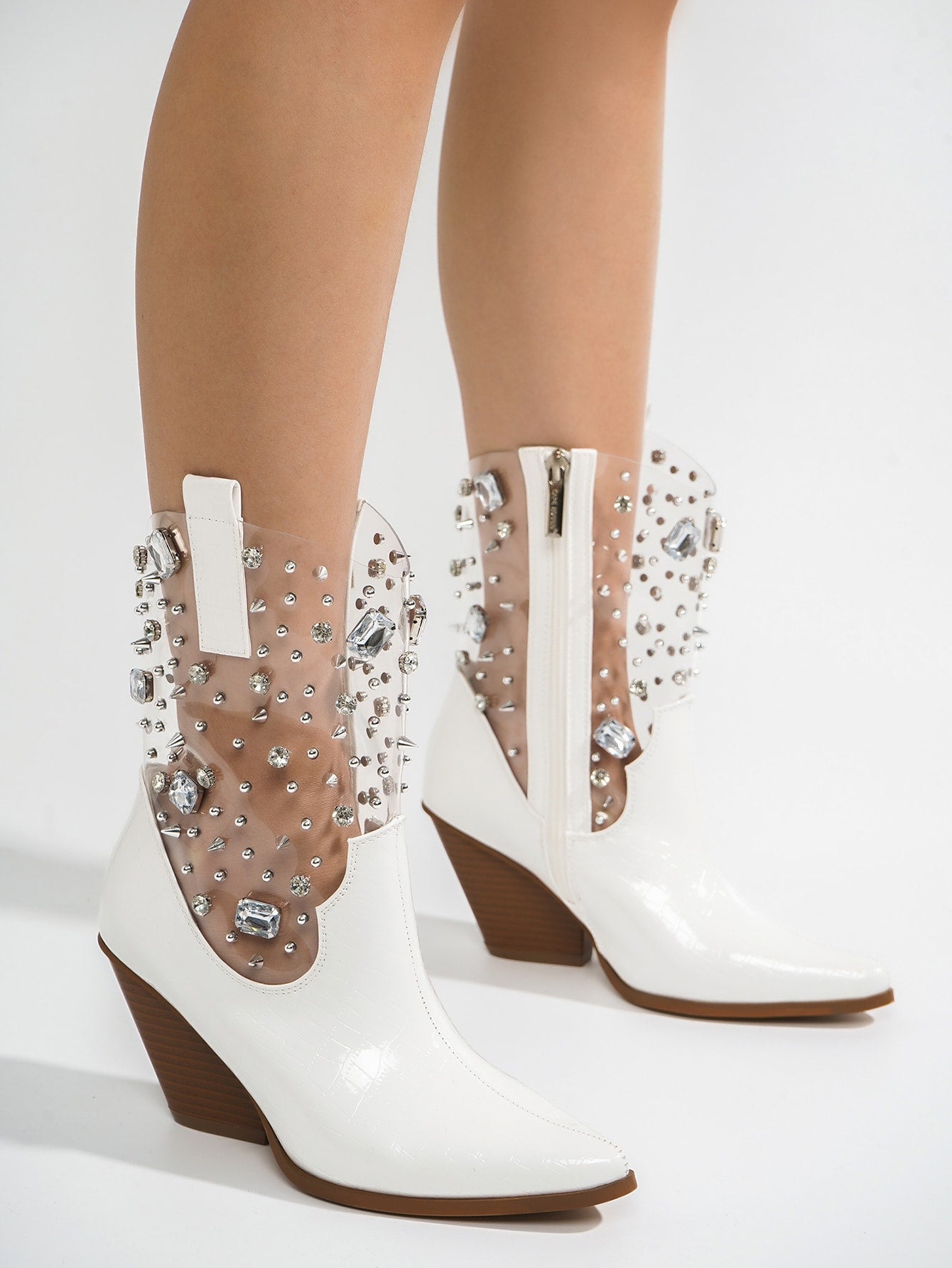 Experience the ultimate western trend with our Glamorous Gemstone Crocodile Boots. Crafted with genuine crocodile leather and adorned with sparkling gemstones, these boots will elevate any outfit. Step out in style and sophistication with these luxurious boots.