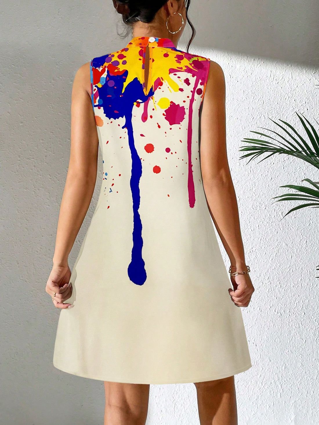Stand out in style with the Bold and Beautiful: Splash Ink Print Mock Neck Dress. This vibrant dress features a unique splash ink print that will make a statement wherever you go. The mock neck adds a touch of elegance while the comfortable fit allows for easy movement. Perfect for any occasion, this dress is sure to turn heads.