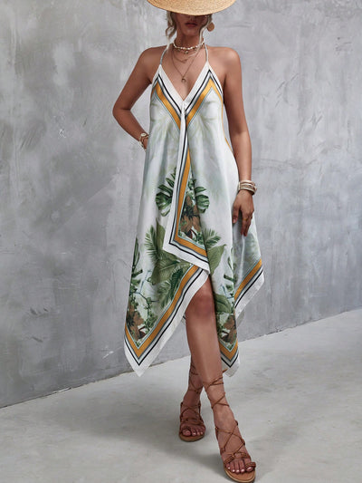 This Summer Chic: Tropical Print Hanky Hem Cami Dress is the perfect summer staple. Made with a tropical print design and a flattering hanky hem, this dress will keep you cool and stylish in the hot weather. Its lightweight and flowy material provides comfort while maintaining a chic look.