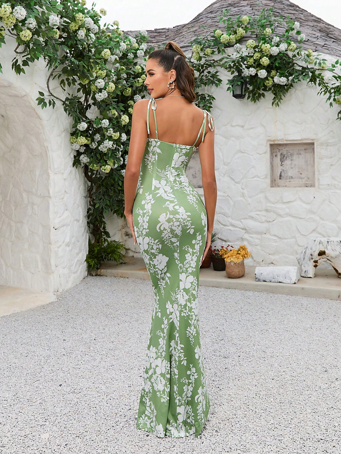 This Blooming Beauty maxi dress features a stunning floral print, tie shoulder details, and a flattering mermaid hem. Perfect for any special occasion, this dress will make you feel elegant and beautiful. Embrace effortless style with this must-have addition to your wardrobe.