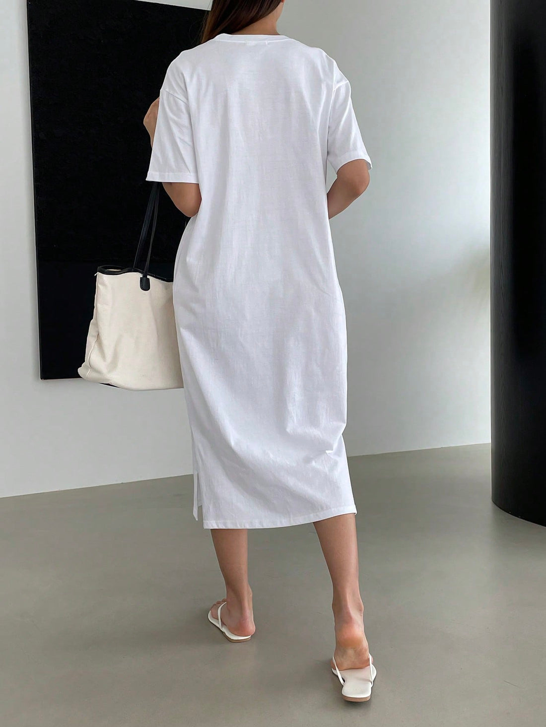 Rock effortless style and comfort with our Vintage Slogan Graphic Drop Shoulder Tee Dress. Made from premium materials, this dress features a trendy vintage slogan graphic and drop shoulder design for a relaxed and stylish look. Perfect for casual days and adding a playful touch to your wardrobe.