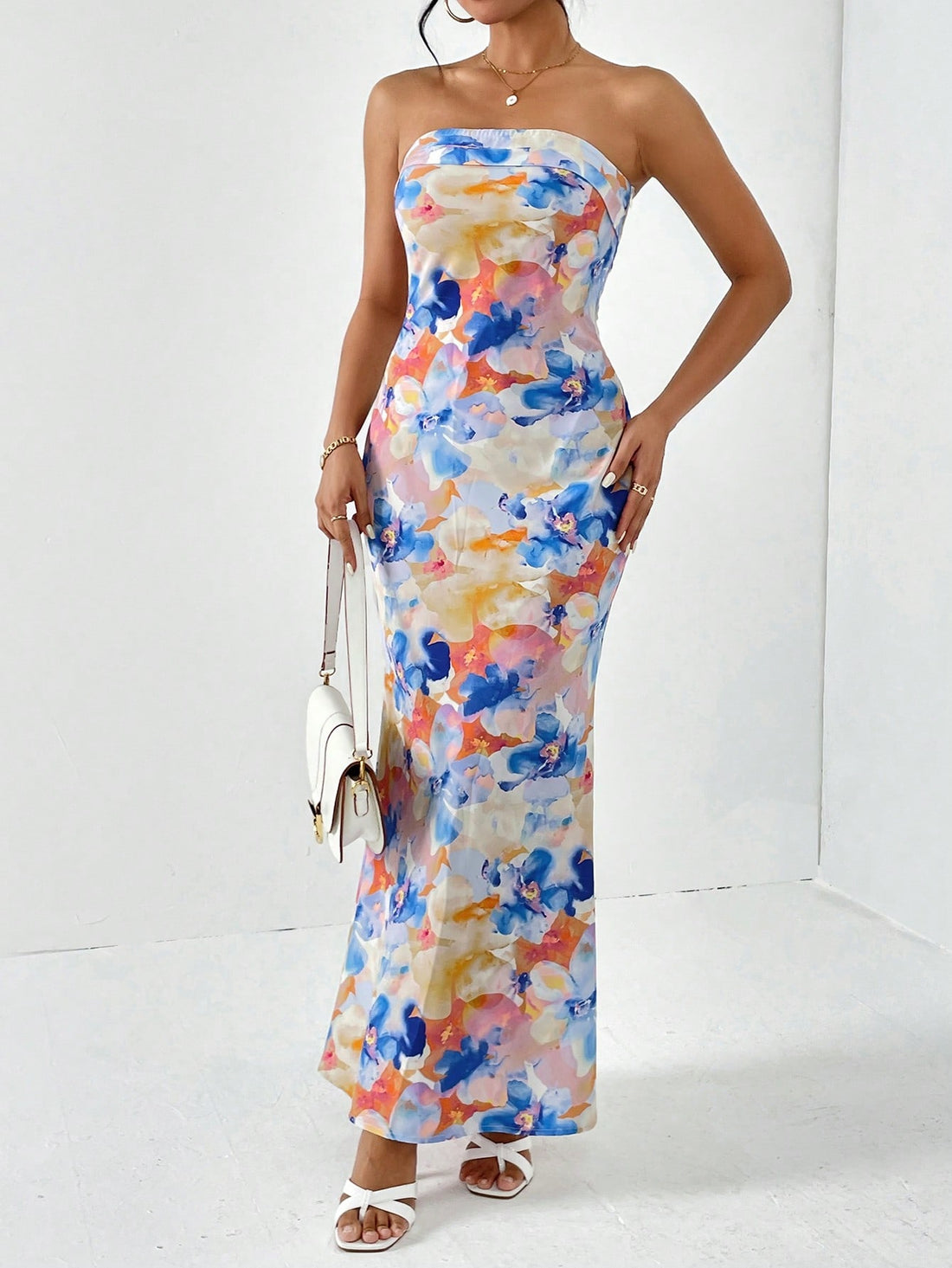 Embrace effortless spring break style with Floral Elegance's Backless Tube Summer Dress. Show off your playful side with its unique design and enjoy its breathable fabric during warm days. Feel confident and chic in this dress at any beach or pool party.