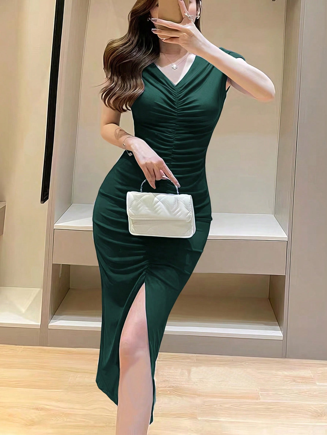 Turn heads with this elegant solid ruched maxi dress! Featuring a chic split thigh detail, this dress adds a touch of sophistication to any occasion. The ruched design offers a slimming effect, while the thigh split adds a subtle hint of allure. Step out in style and confidence with this stunning dress.