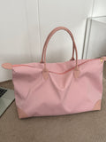 This chic and stylish minimalist nylon tote bag is designed specifically for women. Made from durable nylon fabric, it is lightweight and perfect for everyday use. The minimalist design is both fashionable and functional, making it a must-have accessory for any modern woman. Upgrade your style game with this versatile tote bag.