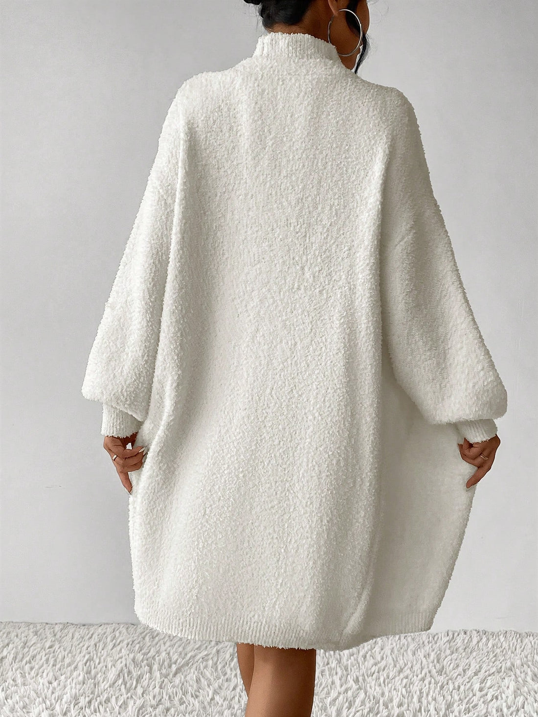Introducing the Chic Comfort: Drop Shoulder Duster Cardigan Sweater Dress, a versatile and stylish addition to your wardrobe. Made with luxury materials, this dress offers ultimate comfort and a flattering silhouette. The drop shoulder design adds a chic touch to any outfit. Upgrade your wardrobe with this must-have dress.