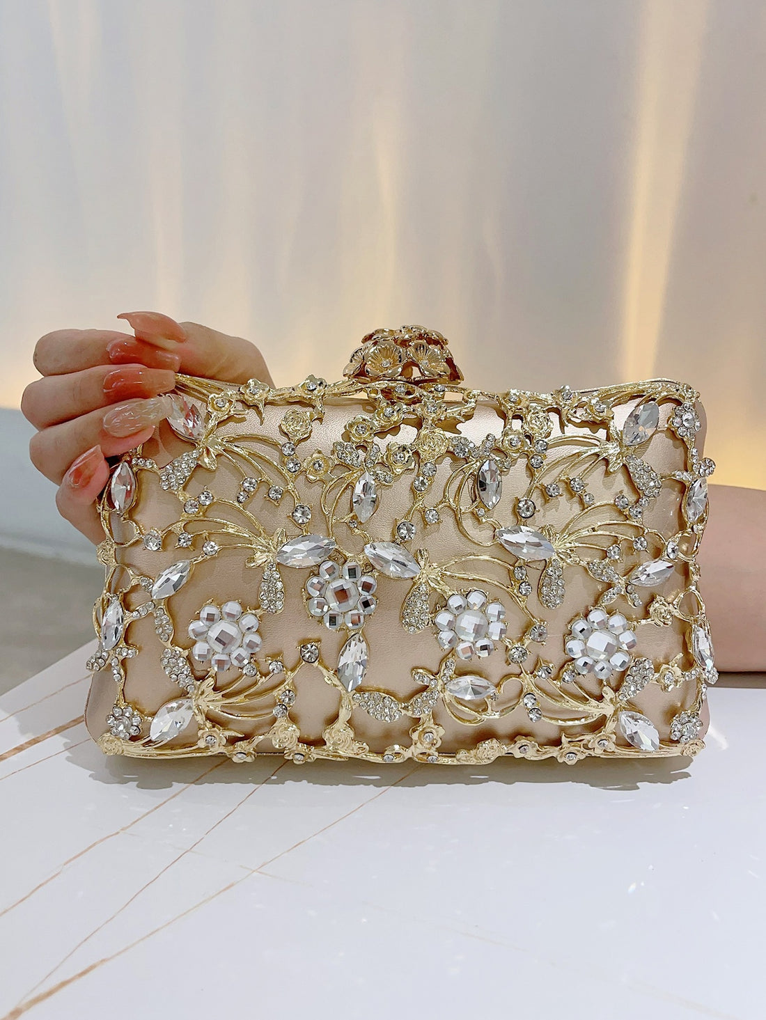 Add a touch of glamour to your evening attire with the Sparkle & Shine Rhinestone Evening Clutch Bag. Featuring elegant rhinestone details, this bag is perfect for special occasions. The sparkly design will make you stand out while keeping your essentials close by. Elevate your style with this stunning accessory.
