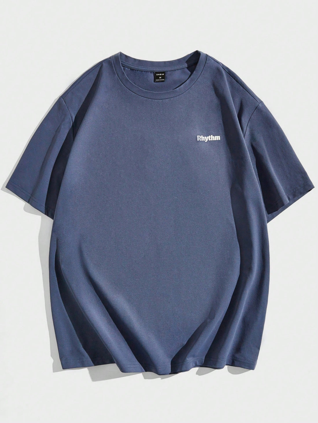 Embrace your playful side in the Loose Fit Men's T-Shirt featuring a unique slogan and cartoon graphic. Made with a loose fit for comfort and style, this shirt is perfect for those who want to make a statement while staying comfortable.