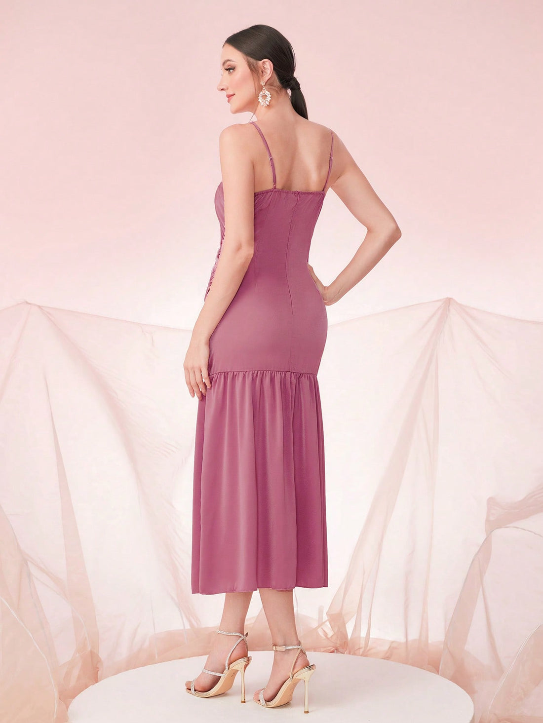 Get ready to turn heads in our Ruched Ruffle Hem Cami Dress! This elegant evening dress is perfect for special occasions and features a stunning ruched ruffle hem that adds a touch of glamour. Stay effortlessly stylish and comfortable at any event.